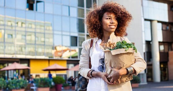 blog picture of lady with groceries smiling