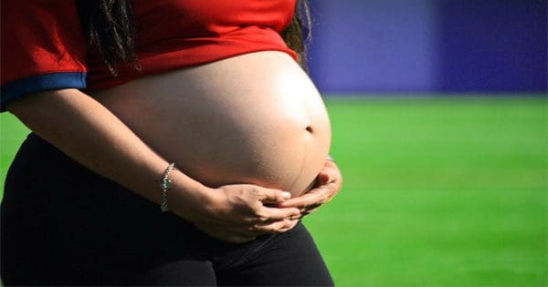 blog picture of pregnant lady grabbing her belly